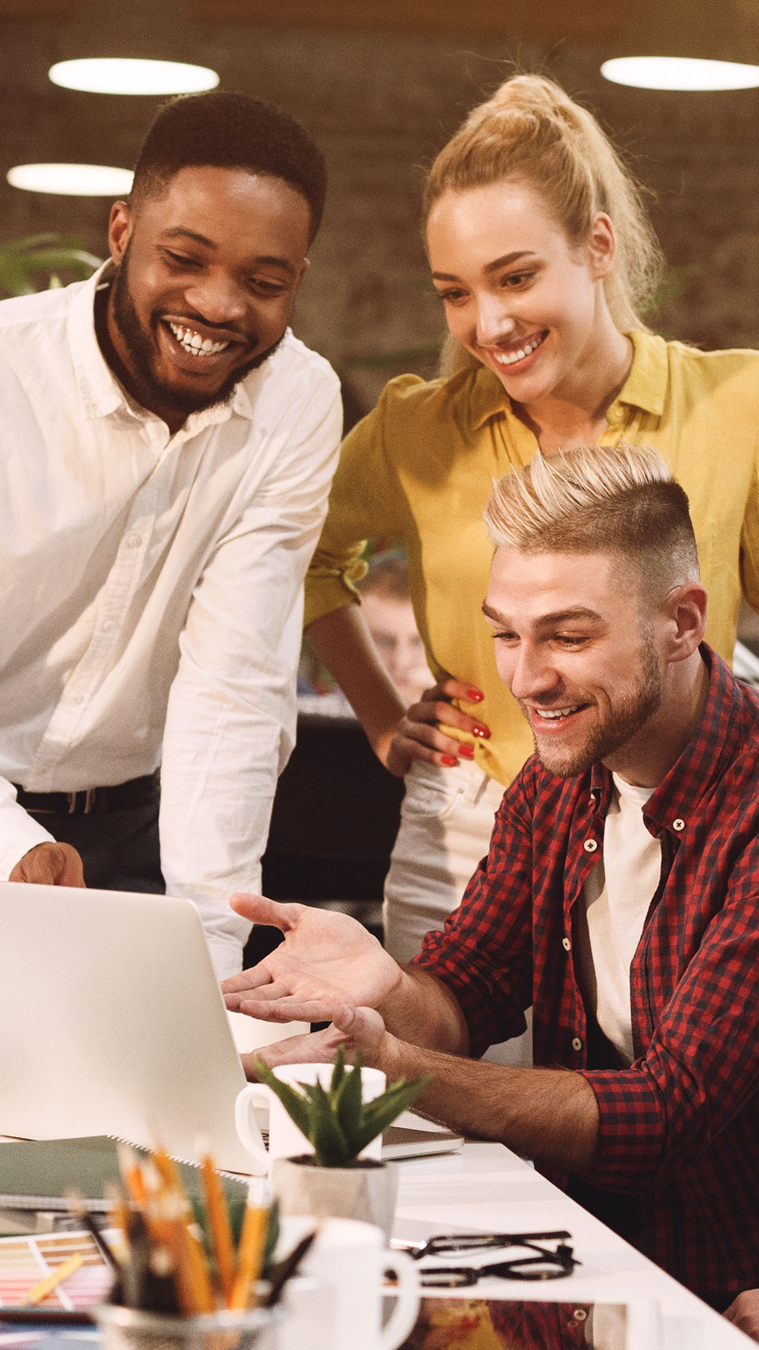 group working together  for blog post on the pros and cons of remote, office and hybrid work